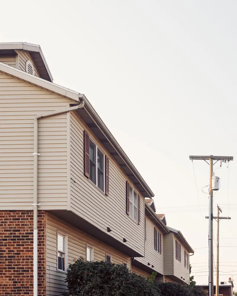 Attached condominium homes with brick and siding