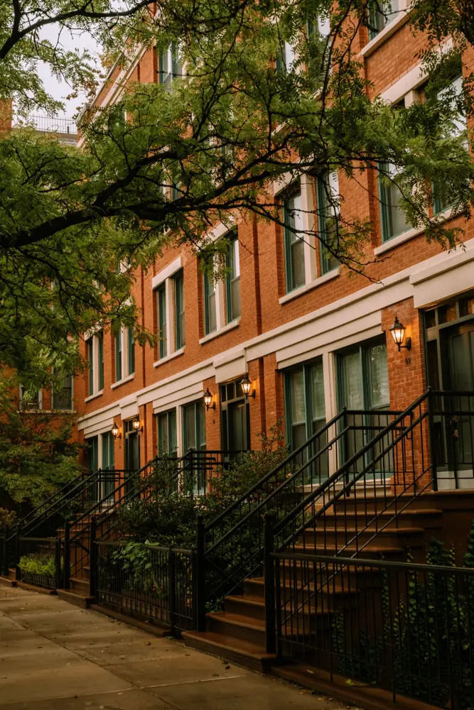 Row of brick townhomes with front stoops